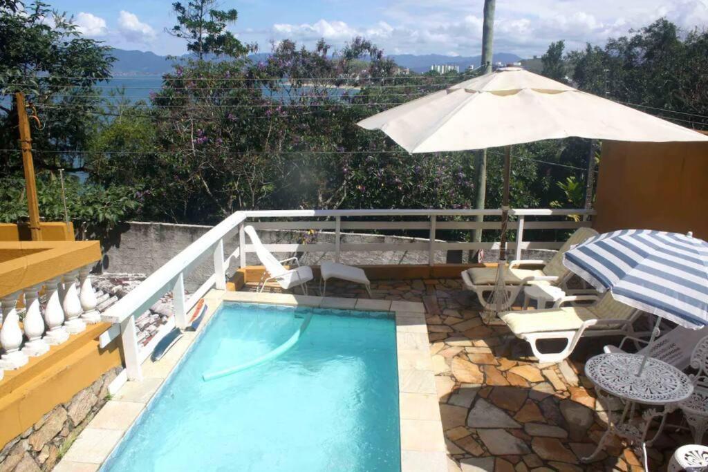Por De Sol No Mar Da Cama Villa Caraguatatuba Exterior foto